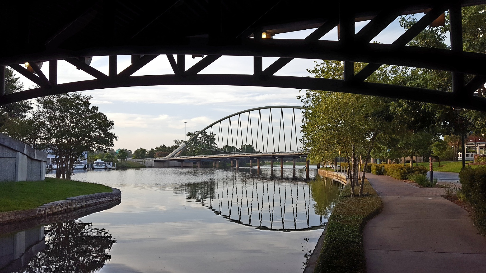 The iconic Woodlands bridge framed by another bridge